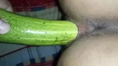 Indian guy during sex in bedroom penetrates GF's pussy with XXX cucumber