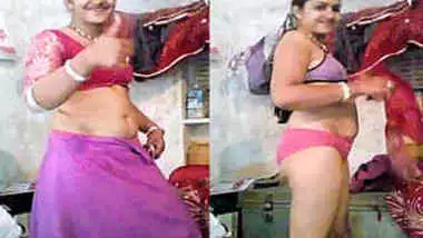 Smiling Indian woman strips down to her underwear in solo porn video
